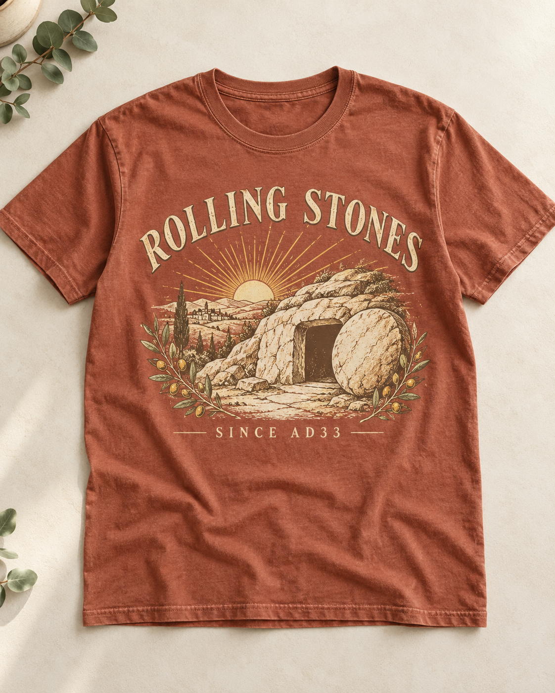 Terracotta Christian shirt mockup showing the stone rolled away from the empty tomb